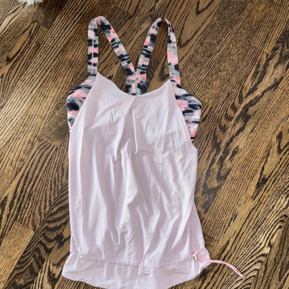 Lululemon pink tank with built-in sports bra. Tightens at the bottom Size 6